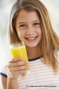 Young Girl Drinking Orange Juice