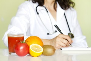 Doctor nutritionist in office with healthy fruits diet concept